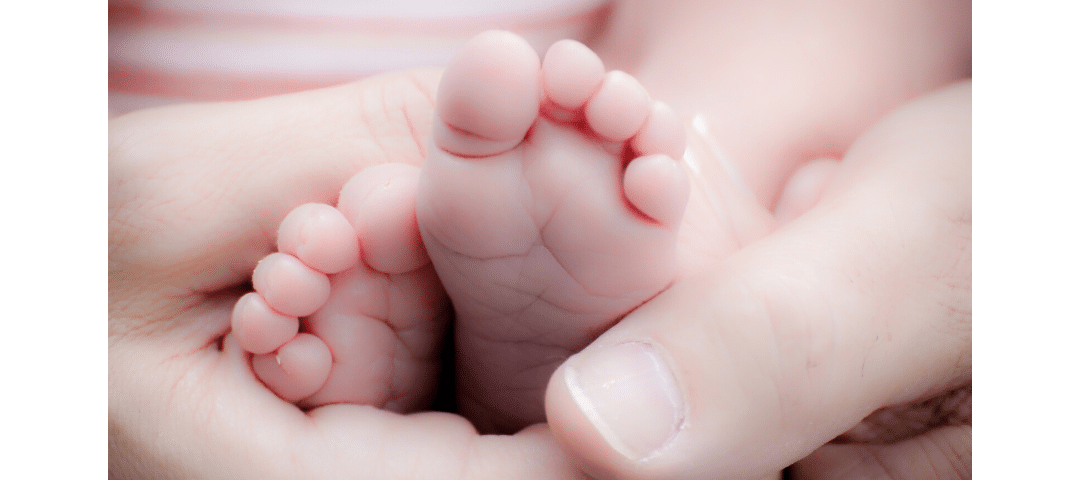 Babies feet in mothers hand