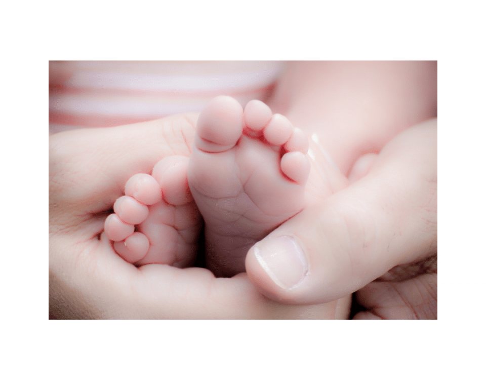 Babies feet in mothers hand