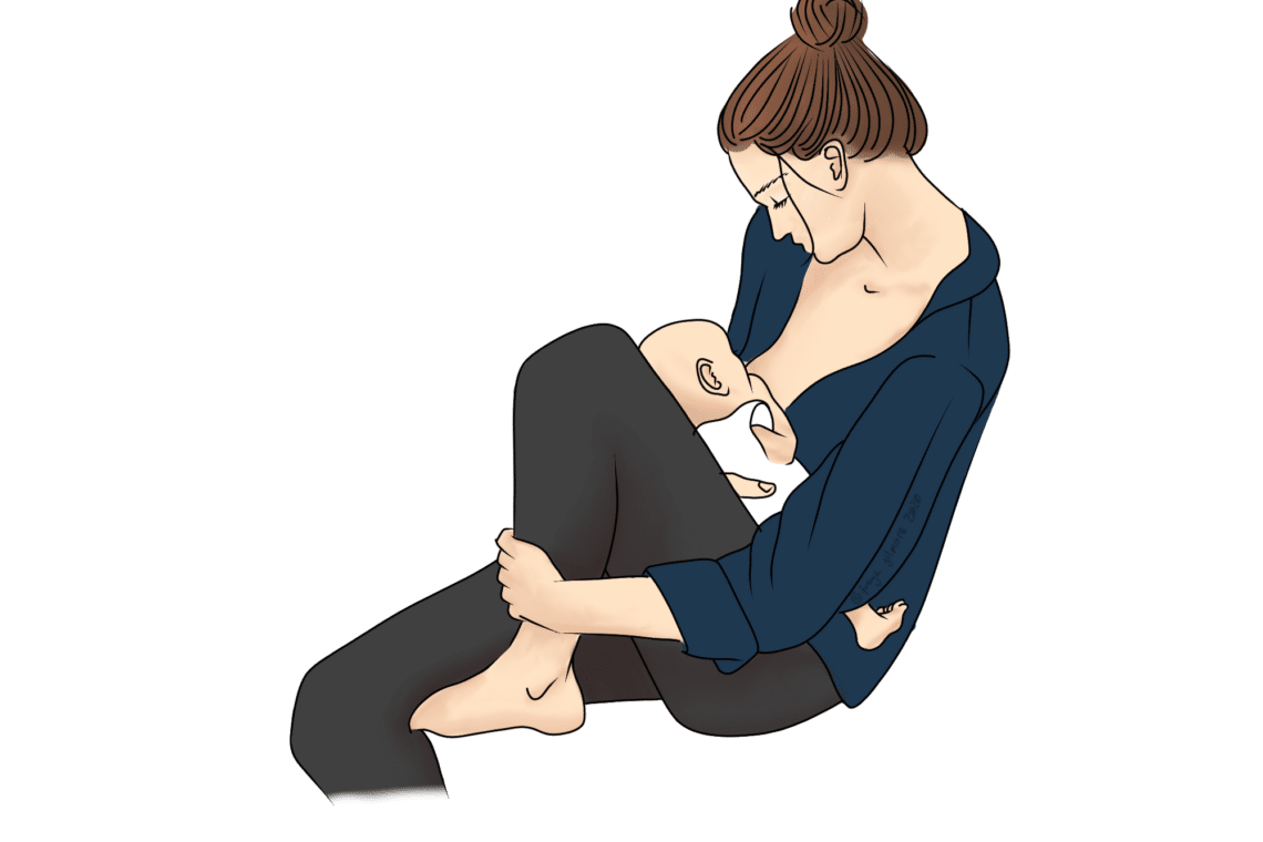 A mother, sitting cross-legged, breastfeeds her baby while looking down tenderly. She wears a navy shirt with her hair in a bun, surrounded by a white background.